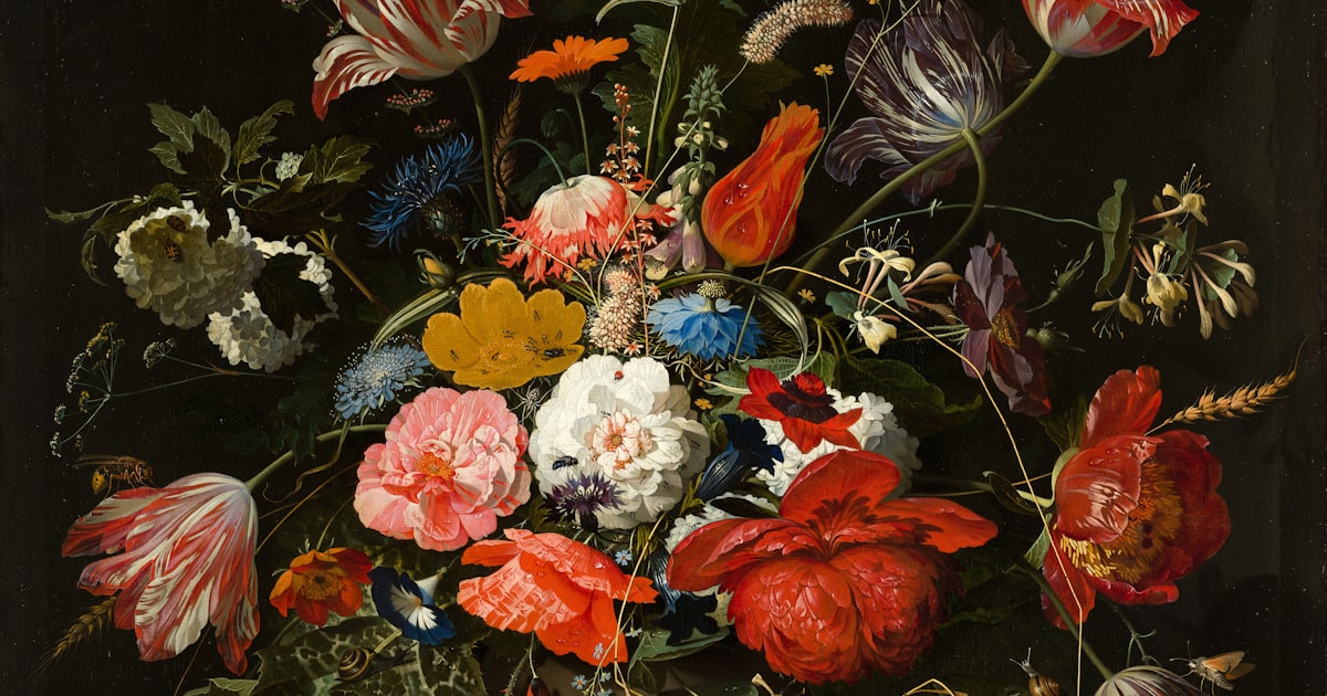 Decorative paper layers and metal brads for scrapbook embellishment